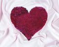 Red sequins heart shape embroidered on white background. Valentines day luxury and glamour greeting card isolated design element.