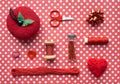 Red Sewing kit accessories and equipment for sewing and Needlework. Various tools for needlework: pin cushion for needles, thread Royalty Free Stock Photo