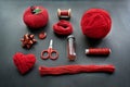 Red Sewing kit accessories and equipment for sewing and Needlework. Various tools for needlework: pin cushion for needles, thread Royalty Free Stock Photo
