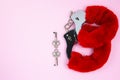 Red sexy fluffy handcuffs with keys on a pink background Royalty Free Stock Photo