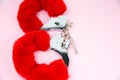 Red sexy fluffy handcuffs with keys on a pink background Royalty Free Stock Photo