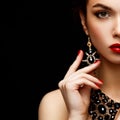 Red Lips and Nails closeup. Manicure and Makeup. Make up concept. Half of Beauty model girl's face on Royalty Free Stock Photo