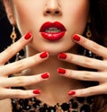 Red Lips and Nails closeup. Manicure and Makeup. Make up concept. Half of Beauty model girl's face on Royalty Free Stock Photo