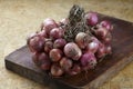 Red shallot onions a group on old chopping Royalty Free Stock Photo