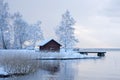 Red shed in white wintry landscape