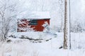 Red shed in a winter forest landscape Royalty Free Stock Photo