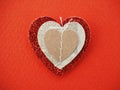 Red shining heart on red paper background Royalty Free Stock Photo