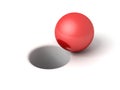 Red shiny ball in front of hole on white Royalty Free Stock Photo