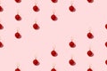 Red shiny Christmas balls on a pink pastel background. Christmas art concept