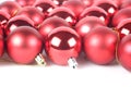 Red shiny and matte christmas balls on white background with copy space