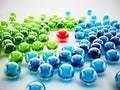 Red shiny sphere standing out among green and blue spheres. 3D illustration Royalty Free Stock Photo