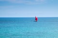 Red ship on red sails. Blue sea and sky. Royalty Free Stock Photo