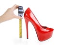 Red shoe and tape measure Royalty Free Stock Photo