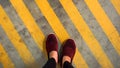 A red shoe on yellow strip line