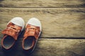 Red shoes for children on wooden floor Royalty Free Stock Photo