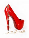 Red shoes and gold necklace Royalty Free Stock Photo