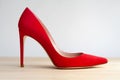 Red shoes made of genuine suede with high heels. Royalty Free Stock Photo