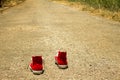 Red shoes are walking on the street moving forward catching bright future on the any ahead opportunity, chances, luck, target, goa