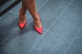 Red shoes on a woman`s legs Royalty Free Stock Photo