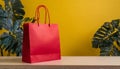 Red shopping bag with empty space, yellow studio background Royalty Free Stock Photo