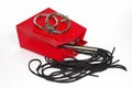 Red shopping bag with flogging whip and handcuff