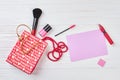 Red shopping bag and makeup accessories. Royalty Free Stock Photo