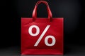 Red shopping bag with percentage sale sign on black background Royalty Free Stock Photo