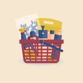Red shopping basket from supermarket with detergents and cleaning products. Women`s household gloves with flowers, washing powder Royalty Free Stock Photo