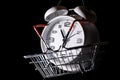 Red shopping basket with white retro alarm clock in it. Lose time. Buy time. Break. Motivation. Business solutions. Success. Royalty Free Stock Photo