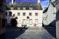 A red shopping cart on the street. Inverness, Scotland. Royalty Free Stock Photo