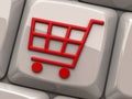 Red shopping cart symbol on computer key