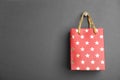 Red shopping paper bag with star pattern on background, space for text Royalty Free Stock Photo