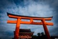 Red shrine gate Torii of Fushimi Inari-taisha shrine with blue cloudy sky in Fushimi-ku, Kyoto Royalty Free Stock Photo