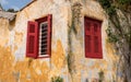 Red shutters on window in ancient district of Anafiotika in Athens Greece