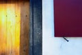 Red shutters and yellow wooden door of an old house Royalty Free Stock Photo