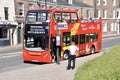 A red sightseeing bus next to York Castle. (2009 Alexander Dennis Enviro 400.) Royalty Free Stock Photo