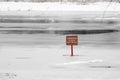 Red sign dangerously thin ice without inscription Snowtime danger red Royalty Free Stock Photo