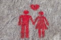 A red sign is drawn on the sidewalk of Porto: the heart, man and woman hold hands. A sign of free space for couples Royalty Free Stock Photo