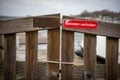 On red sign at a gate is written in german: Betreten verboten Royalty Free Stock Photo