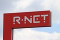 Red sign of the R-NET transport system at the trainstation of Gouda.