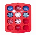 Red Silicone Mold with Snowflake Designs on White Background Royalty Free Stock Photo