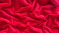 Red silk fabric background with waves close Royalty Free Stock Photo