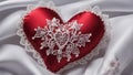 A red silk heart with a white lace border on a white background. The heart is smooth and shiny, silk Royalty Free Stock Photo