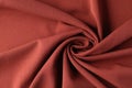 Red silk luxury drapery fabric texture background closeup