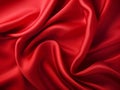 Red silk satin background with Beautiful soft wavy folds on smooth shiny fabric