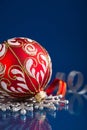 Red and silver christmas ornaments on dark blue background Royalty Free Stock Photo