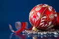 Red and silver christmas ornaments on dark blue background Royalty Free Stock Photo