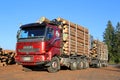 Red Sisu 18E630 Timber Truck Ready to Unload Logs