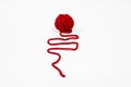 Red skein of thread against white background. Red ball of wool red thread isolated on white Royalty Free Stock Photo