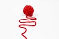 Red skein of thread against white background. Red ball of wool red thread isolated on white Royalty Free Stock Photo